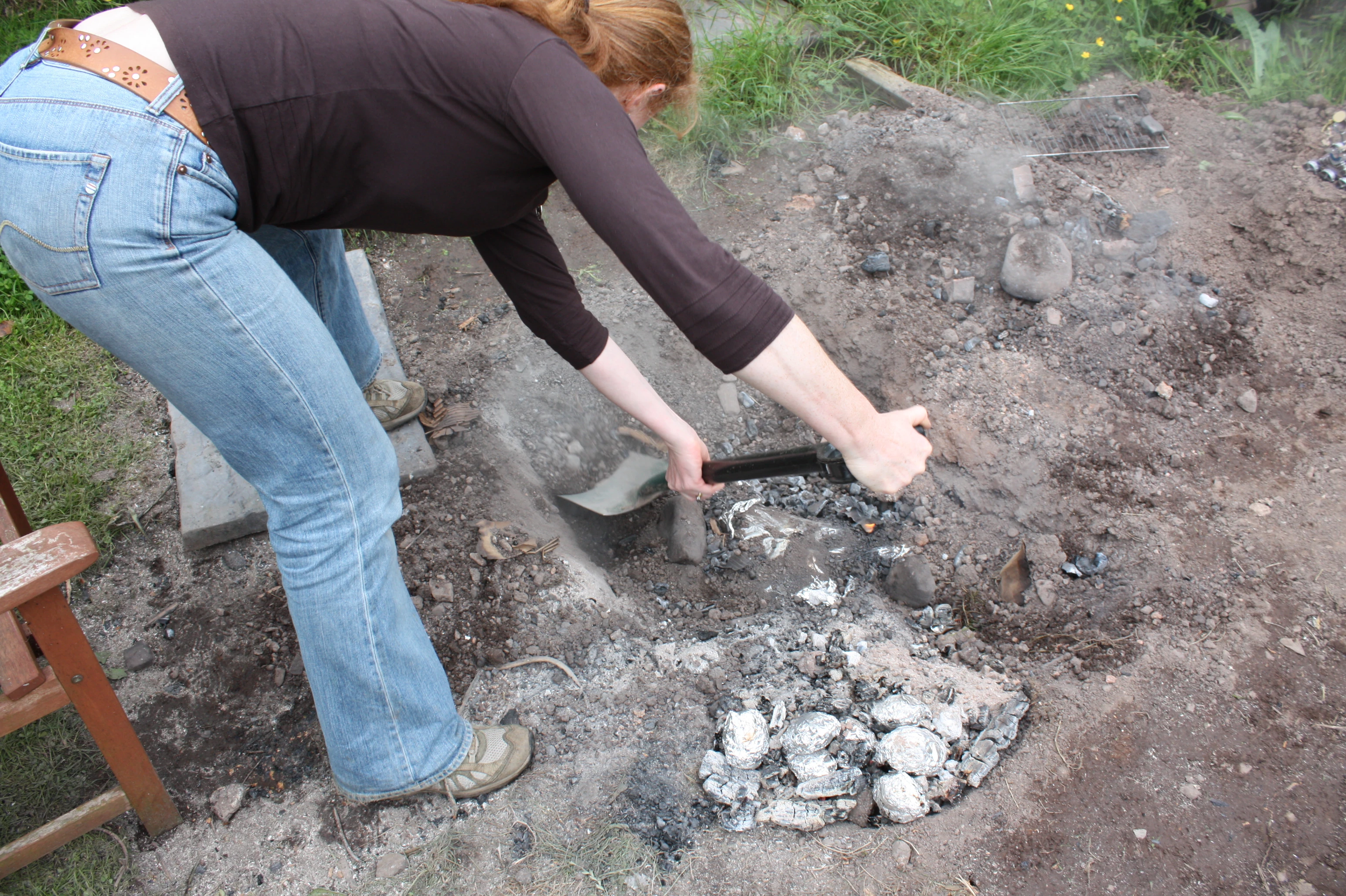 Stage 10: Carefully excavate and remove the wrapped meat