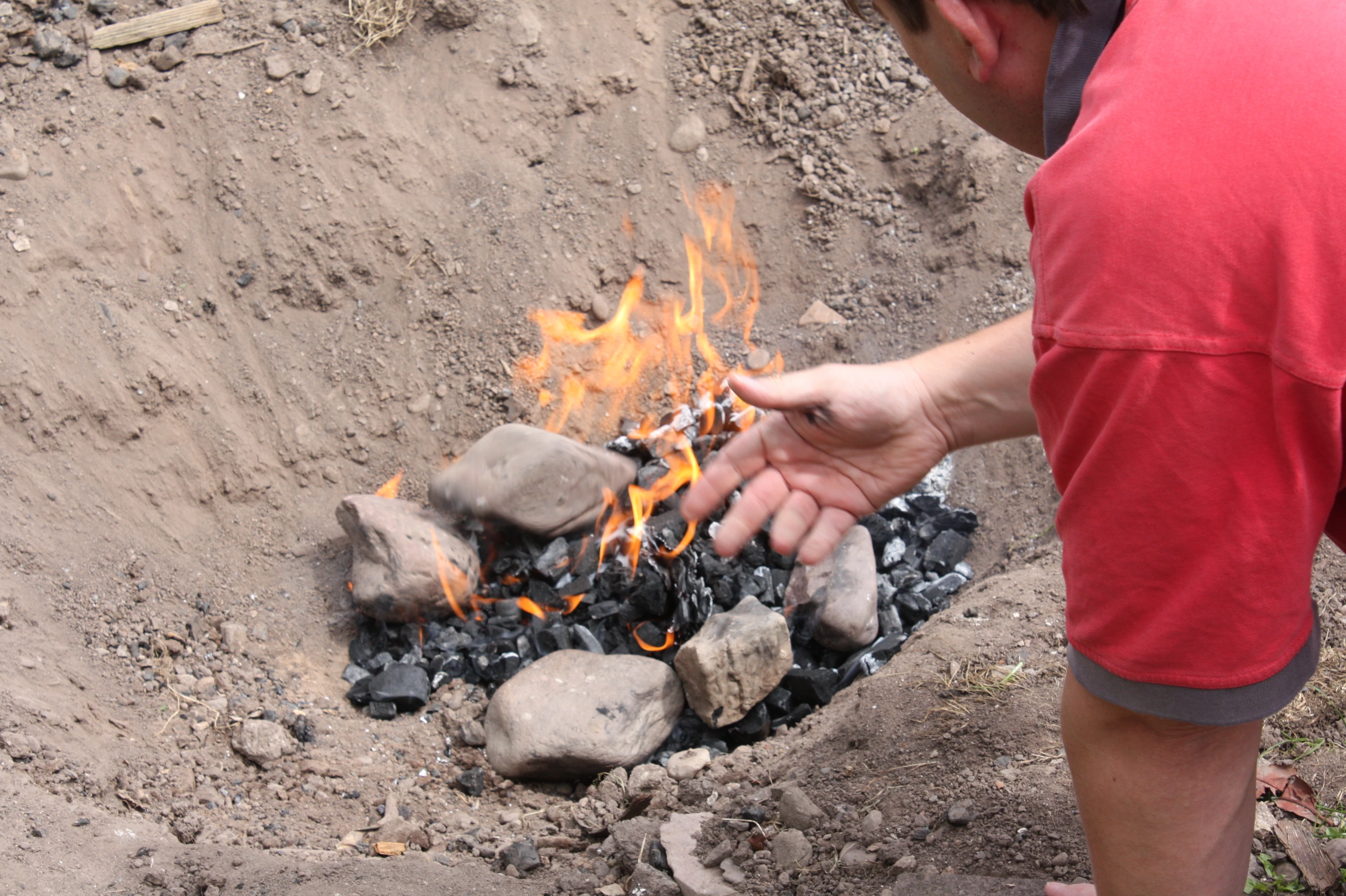 A more conservative fire is set in the base of the pit