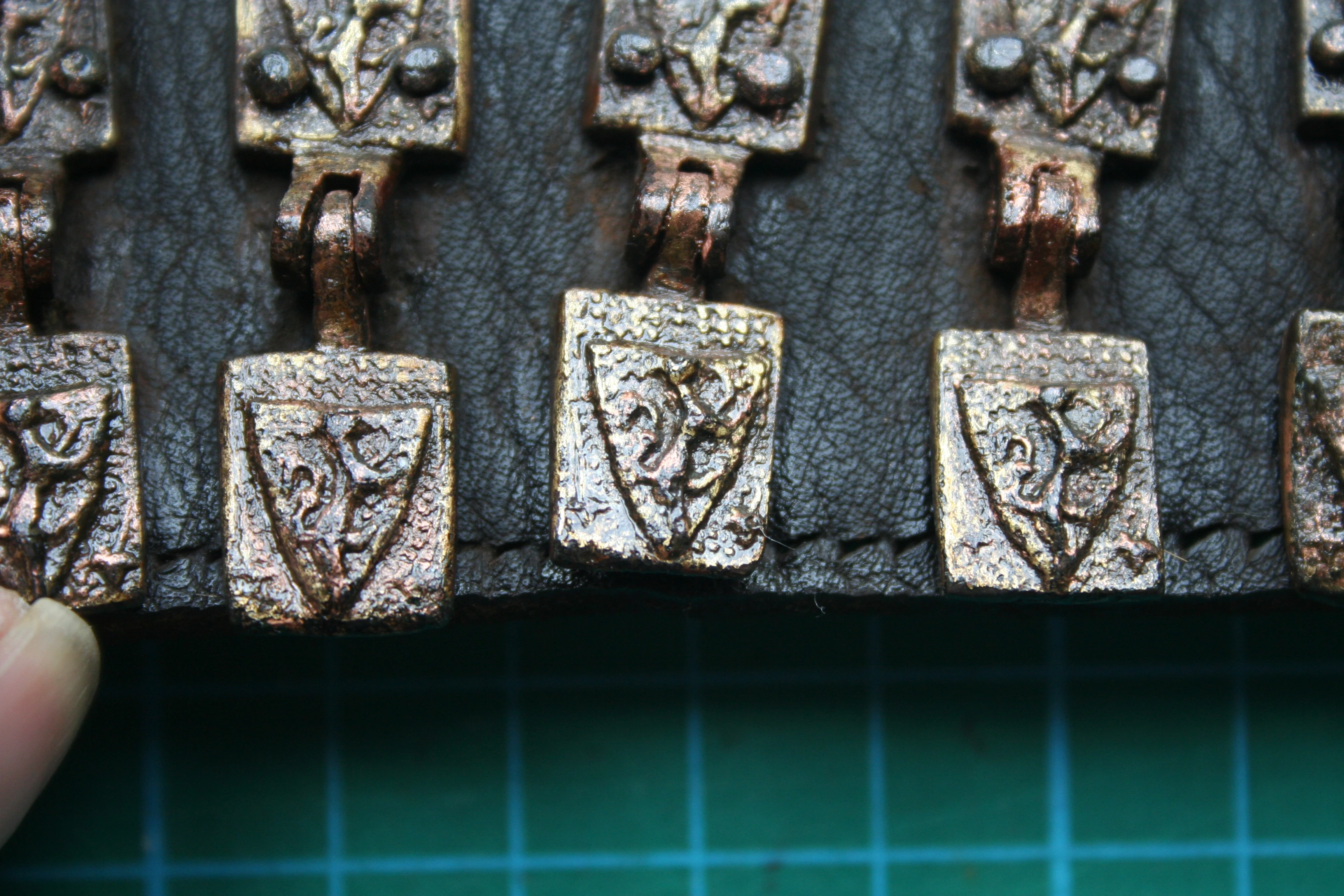 A detail shot showing the stunning condition of the belt, replete with hinged heraldic motifs (Photo: John Nicholl)