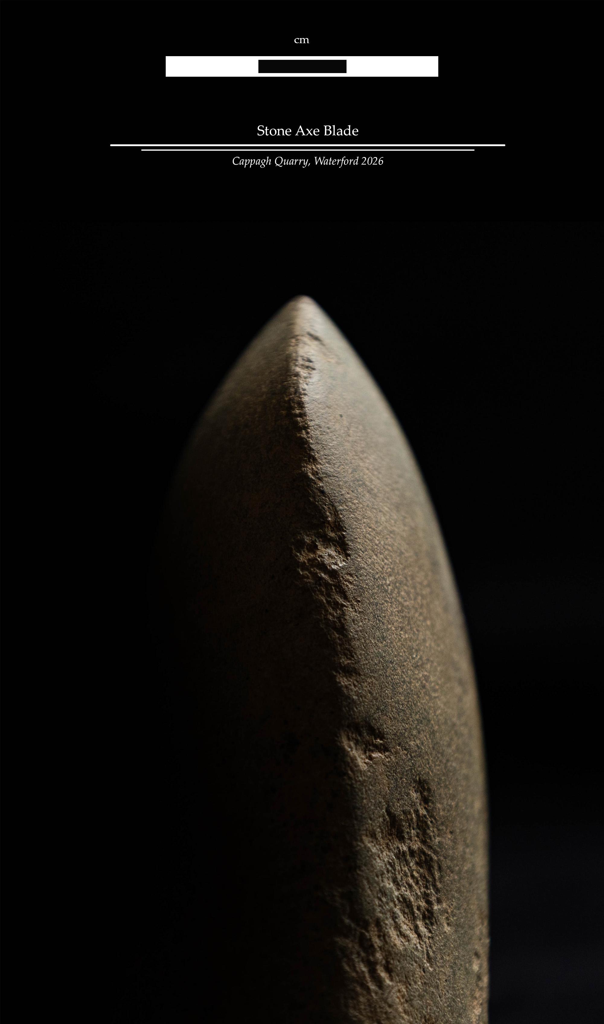 Studio photograph of a second stone axe from Cappagh